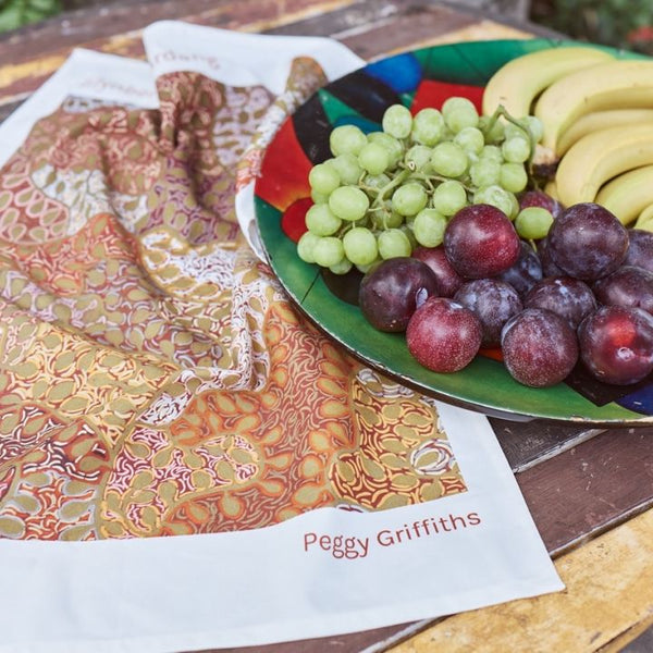 Peggy Griffiths - Tea Towel - Represented by Waringarri in collaboration with AACHWA, Make it Real (m/aac007)